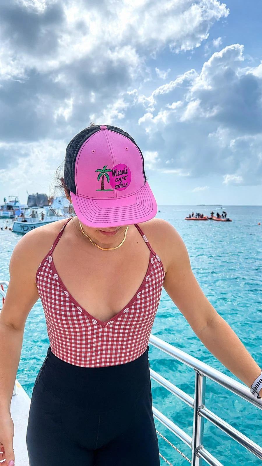 Mervis’ pink cap by the ocean